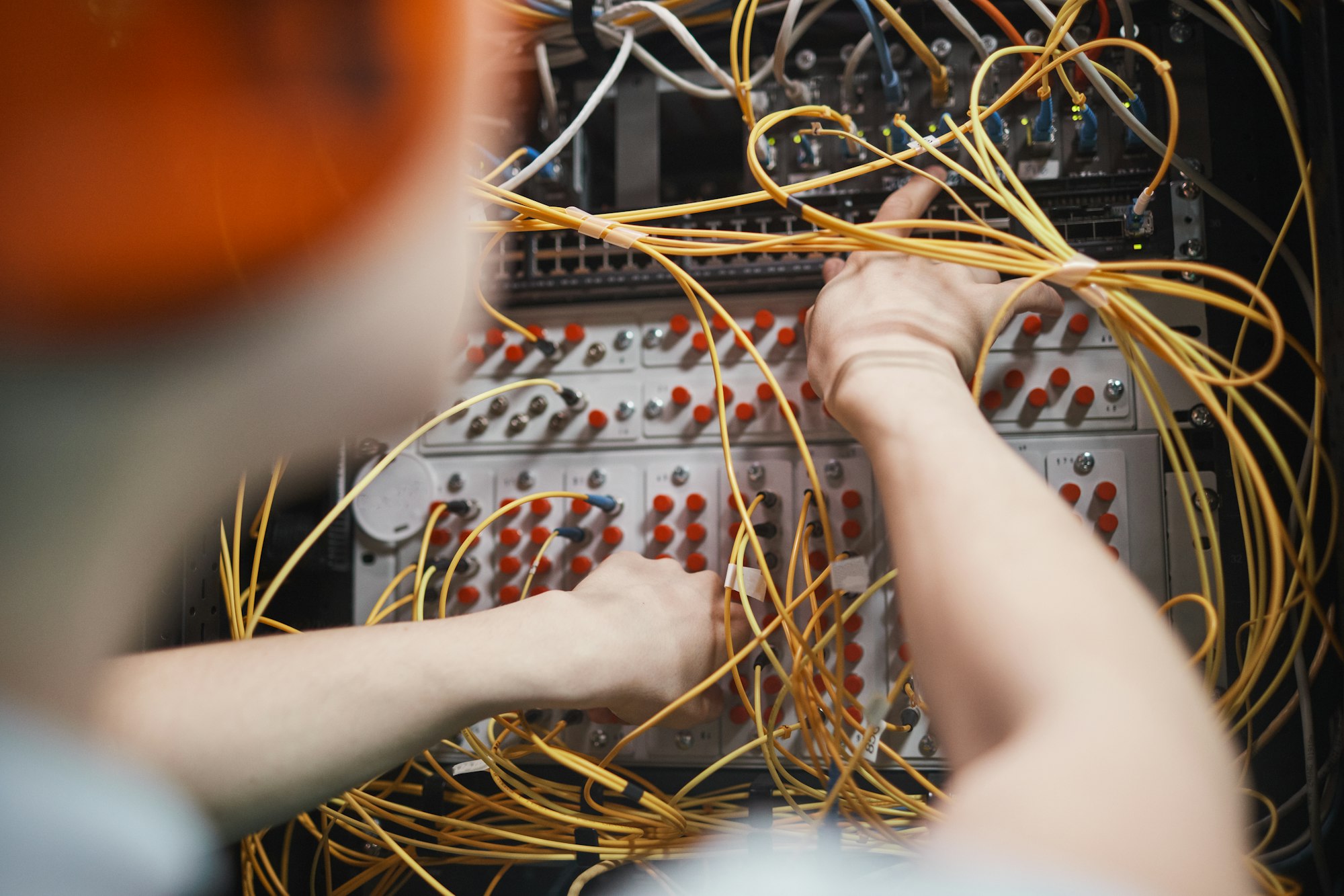 Network Engineer Connecting Cables